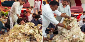 ভিডিও ভাইরাল: টাকার পাহাড়ে চাপা পড়লেন শিল্পী! জুনাগড়ে ভজন অনুষ্ঠানে এ কী কাণ্ড ঘটালেন ভক্তরা?